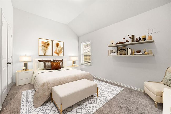Bright and airy bedroom with a vaulted ceiling, plush carpeting, and abundant natural light. *Virtually Staged | Image 19