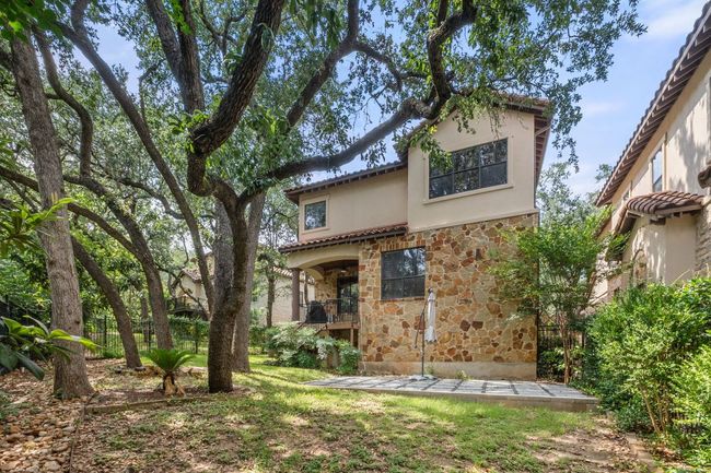 Rear view of property with stone siding and stucco siding | Image 39