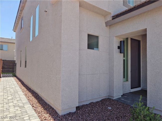 View of property exterior featuring stucco siding | Image 42