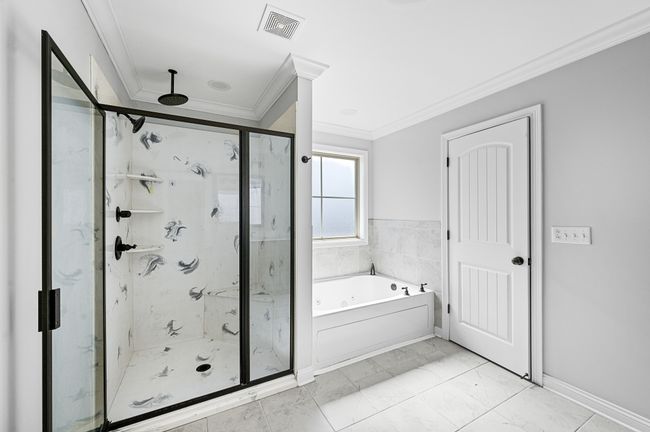 Primary bath with walk in shower and separate tub. | Image 49