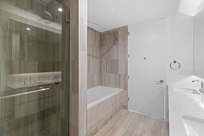 Full bathroom with double vanity and a sink | Image 15