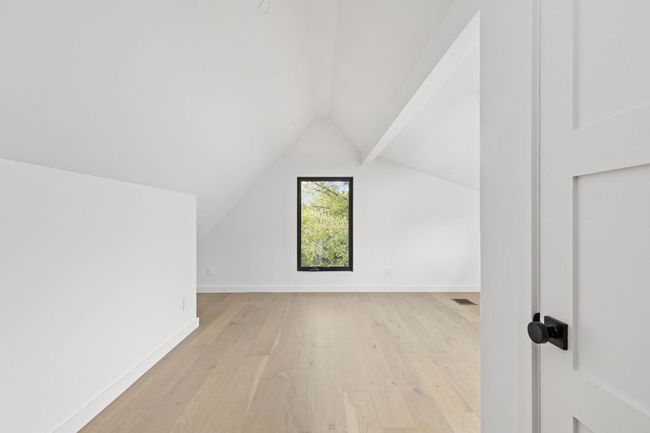 Additional living space featuring lofted ceiling and light wood-style flooring | Image 28