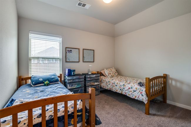 Bedroom with carpet flooring and baseboards | Image 24
