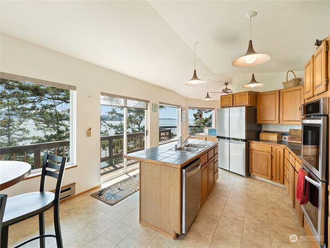 Slider in the middle is good for entertaining. From kitchen right out the sliders to the deck. | Image 14