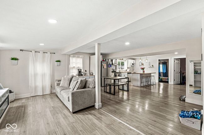 living area featuring light wood finished floors, recessed lighting, and baseboards | Image 4