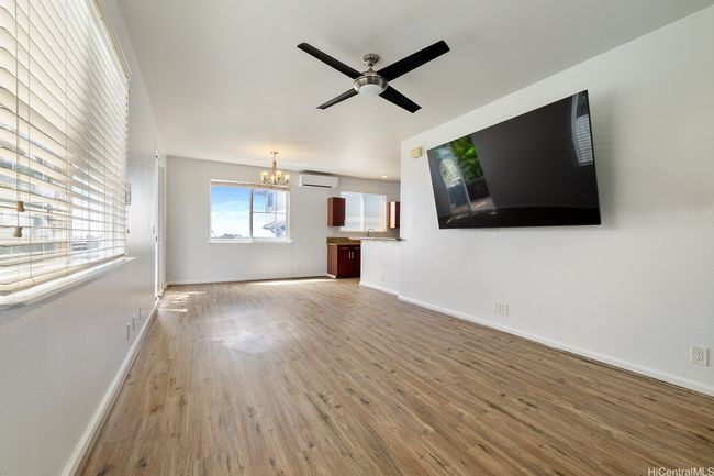 Standing near your front door, you can see almost the full expanse of the living room. | Image 9