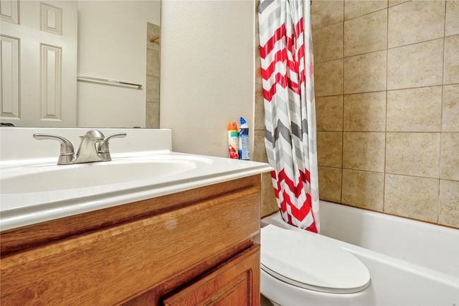 Bathroom featuring vanity and shower / bath combo with shower curtain | Image 30