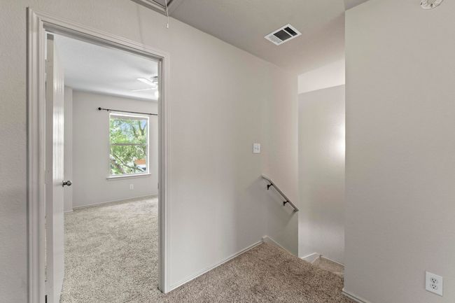 The bright stairwell invites you to the 2nd level where all bedrooms are located. | Image 15