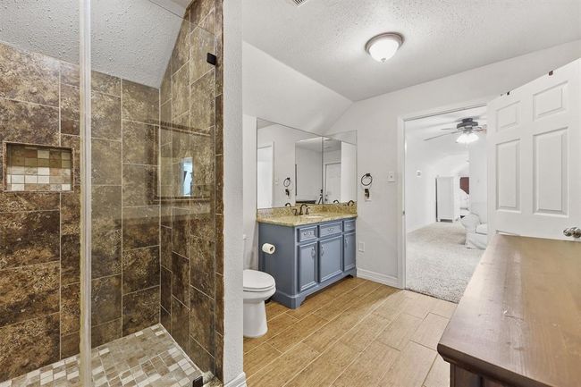 Spacious upstairs bathroom featuring a walk-in shower, modern finishes, and ample room for daily routines or guest use. | Image 17