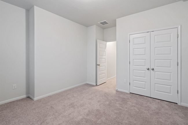 Unfurnished bedroom with baseboards, visible vents, a closet, and carpet | Image 32