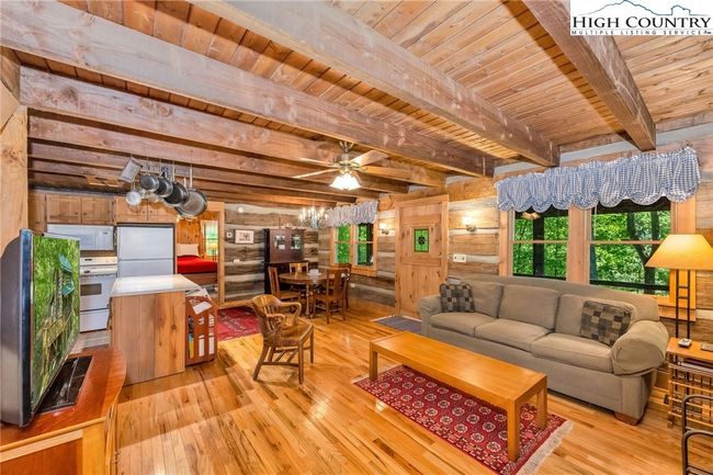 Warm hardwood flooring unifies the entire main level. | Image 11