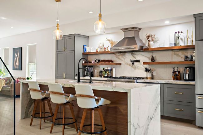Bar with wall chimney range hood, tasteful backsplash, pendant lighting, light wood finished floors, and recessed lighting | Image 9