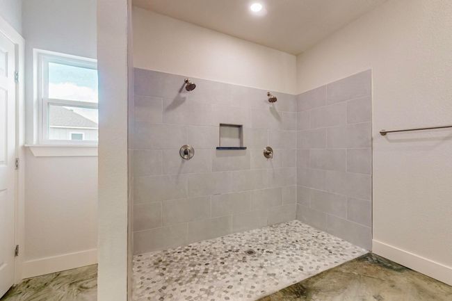 Full bathroom with a walk in shower and baseboards | Image 30