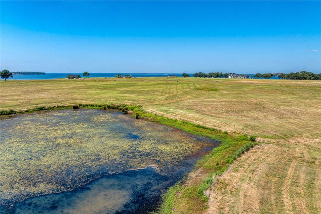 Lot 70 view from back of property and pond | Image 13