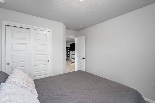 Carpeted bedroom with a closet and baseboards | Image 24