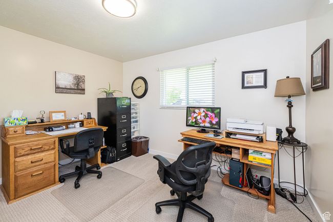Home office with baseboards and light colored carpet | Image 31