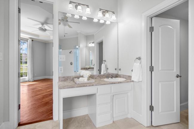 Dual sink vanity, and a dedicated makeup or dressing area. | Image 17