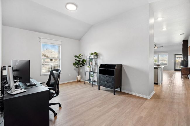 Continuing straight through the entry you'll find the first versatile space, ideal for formal living, dining, or a home office. | Image 5
