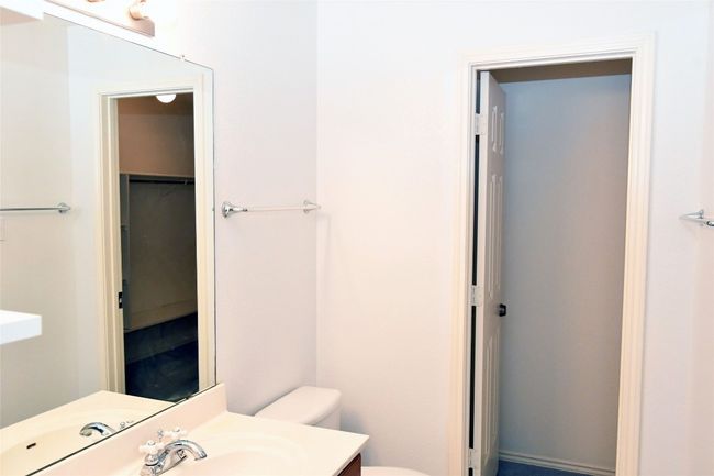 Bathroom featuring toilet and vanity | Image 15
