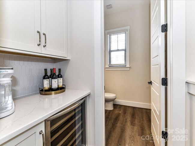 Bar Area with Beverage Refrigerator & custom tile back splash! | Image 11