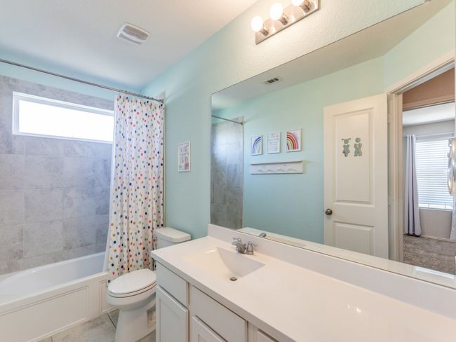 Bathroom with vanity and shower / bath combo with shower curtain | Image 29