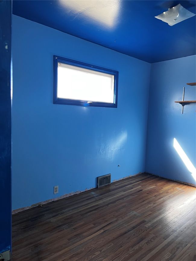 Unfurnished room with visible vents and wood finished floors | Image 61
