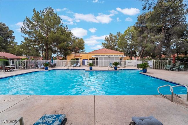 View of pool featuring a patio area and fence | Image 41