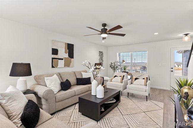 Living area with light wood-type flooring, ceiling fan, recessed lighting, and baseboards | Image 5