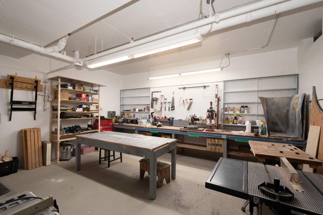 Garage featuring a workshop area | Image 32