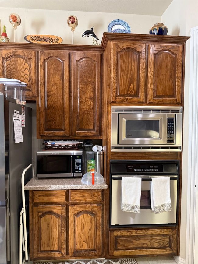 Kitchen with wall oven, refrigerator, and light​​‌​​​​‌​​‌‌​‌‌​​​‌‌​​‌‌​‌​​​​​‌ countertops | Image 8