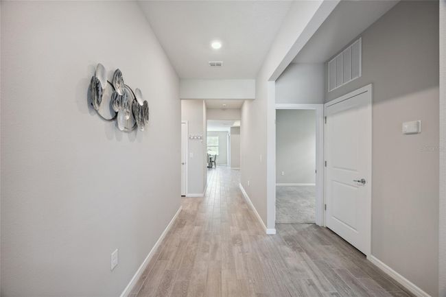 Foyer with beautiful grey designer tile throughout living area | Image 4