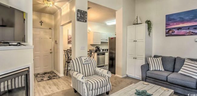 Living area featuring baseboards and light wood-style floors | Image 6
