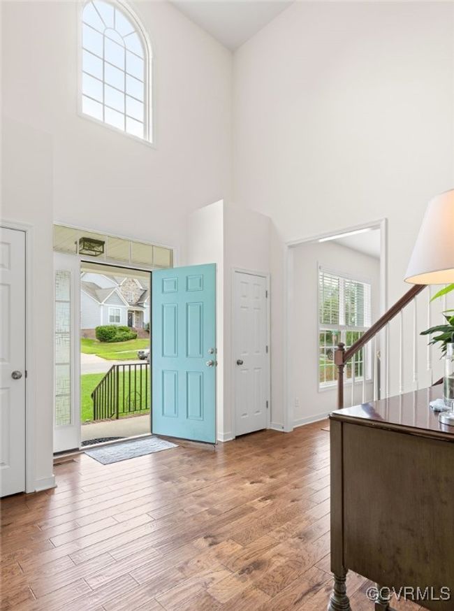Stunning 2-story foyer with hardwood floor throughout 1st floor living space | Image 4