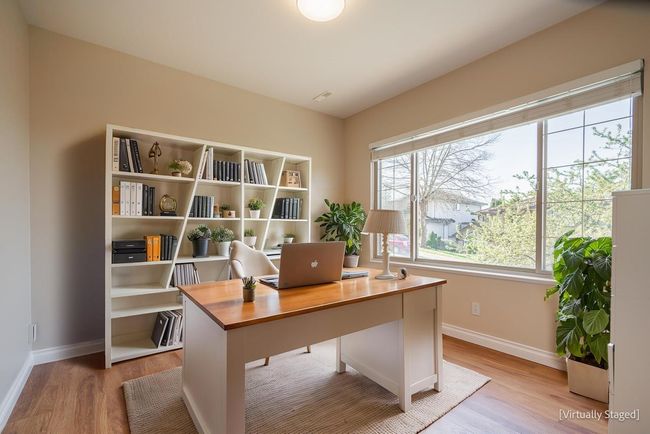Office featuring light wood-style floors and baseboards | Image 4