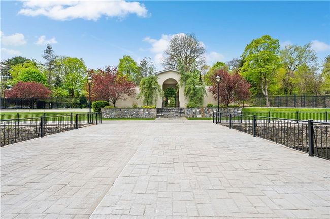 View of surrounding community and entrance to the pool. | Image 19