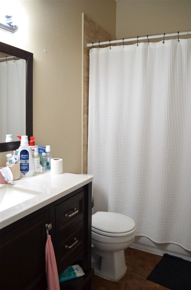 Bathroom featuring vanity and toilet | Image 8