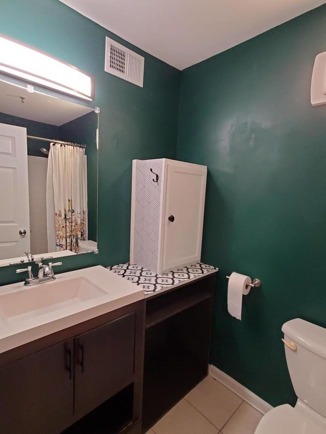 kitchen and living room -- ceiling fan in living r | Image 8