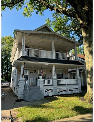 View of front of home featuring a balcony and a porch | Image 1