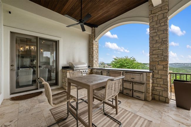 View of patio / terrace featuring a ceiling fan and a sink | Image 23