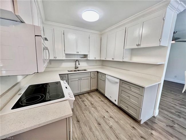 Kitchen with QUARTZ tops and newer cabinets. | Image 10