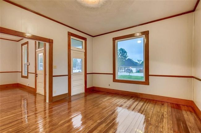 Spare room with hardwood / wood-style floors, ornamental molding, and baseboards | Image 7