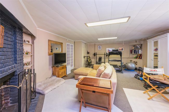 Family room enjoys enough space for gym equipment as well! | Image 28