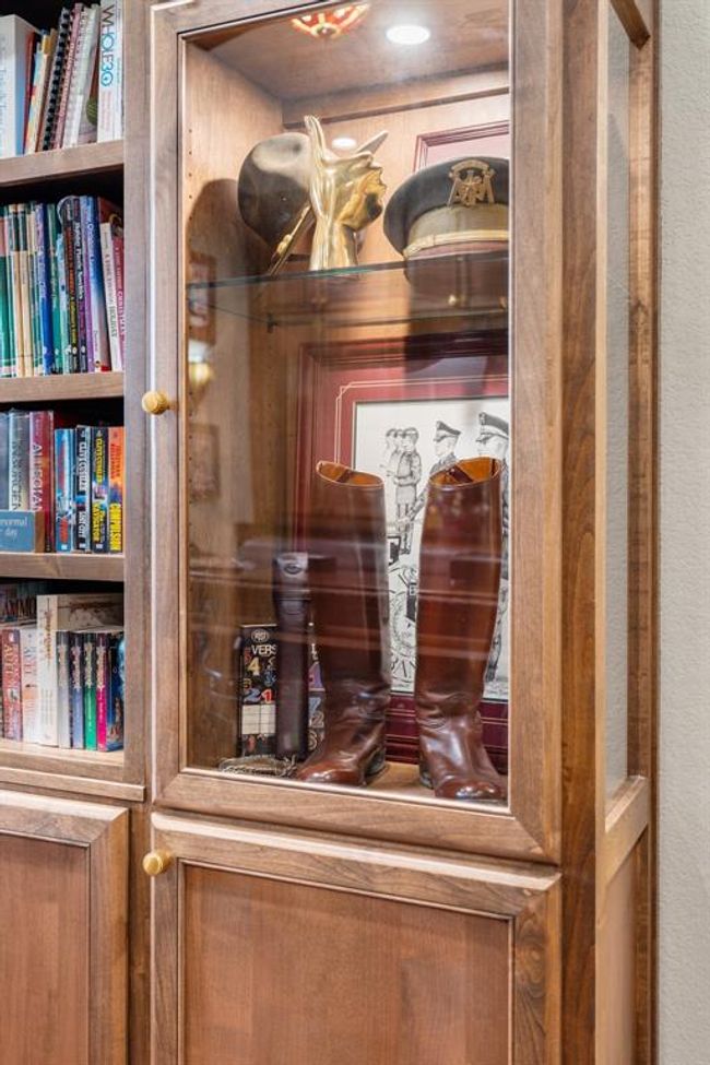 The custom-designed hand-crafted and lighted glass display case is a beautiful feature. | Image 16