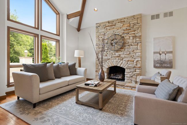Cozy up to the gas log stone fireplace | Image 10