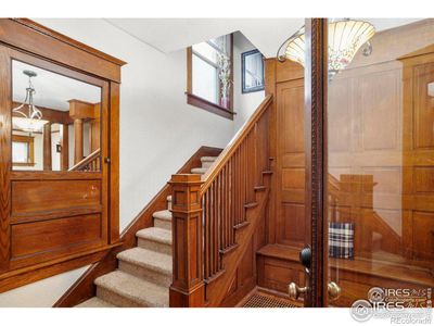 Beautiful entry way - Original 1899 carved stained carved wood. Original Full Glass Front Door! | Image 2