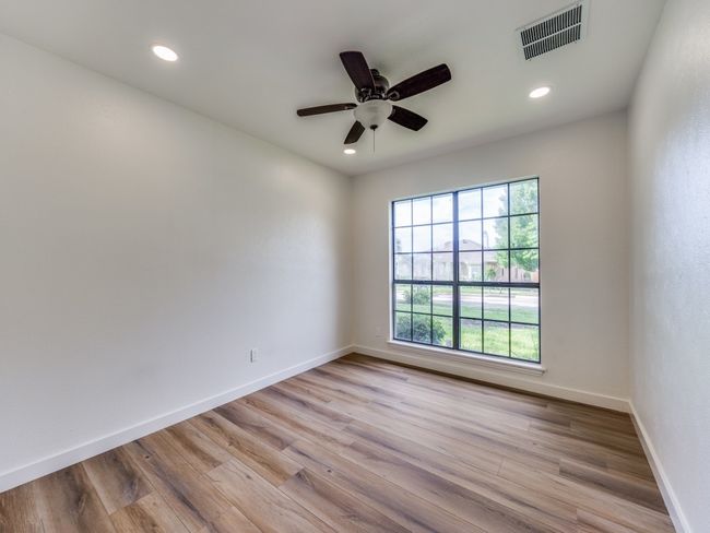 Spare room featuring light wood-style flooring, recessed lighting, and ceiling fan | Image 15