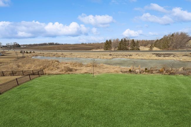 The backyard is very flat making it useable for many things. | Image 37