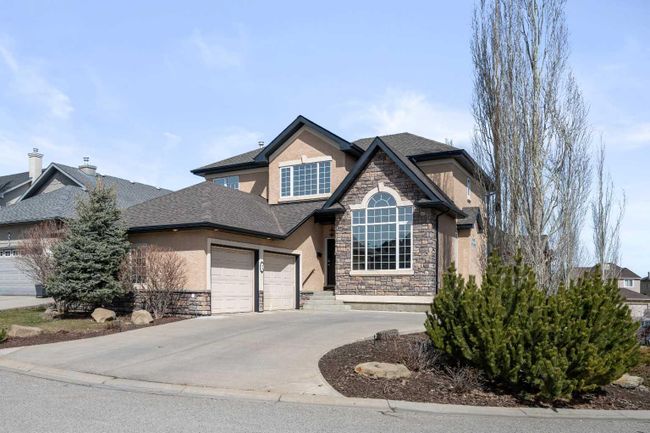 32 Evercreek Bluffs Crescent Sw, Home with 4 bedrooms, 3 bathrooms and 4 parking in Calgary AB | Image 1