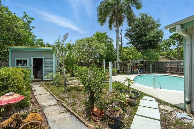 View of pool with a fenced backyard | Image 28