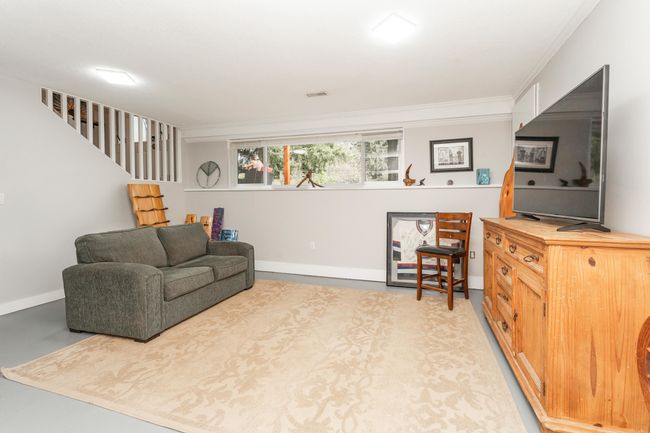Sitting room with ornamental molding, stairway, and baseboards | Image 19